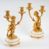 Paire de candélabres style Louis XVI en bronze doré Un Amour et Un Faune d'après Clodion et Delarue