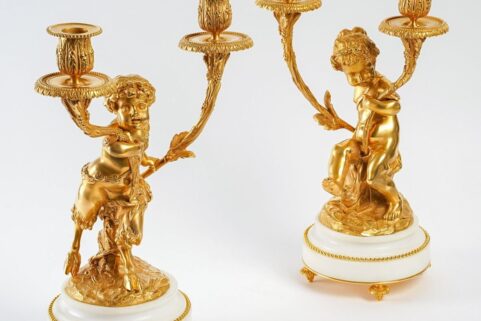 Paire de candélabres style Louis XVI en bronze doré Un Amour et Un Faune d'après Clodion et Delarue