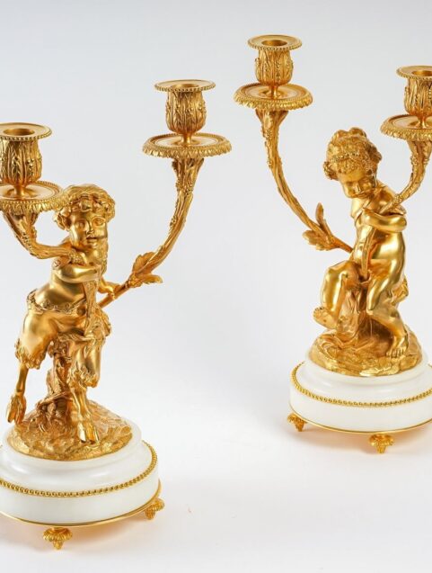 Paire de candélabres style Louis XVI en bronze doré Un Amour et Un Faune d'après Clodion et Delarue