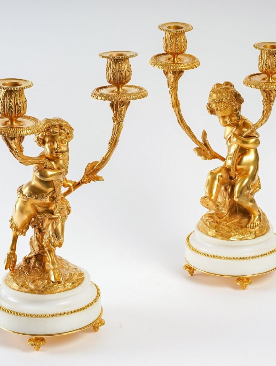 Paire de candélabres style Louis XVI en bronze doré Un Amour et Un Faune d'après Clodion et Delarue