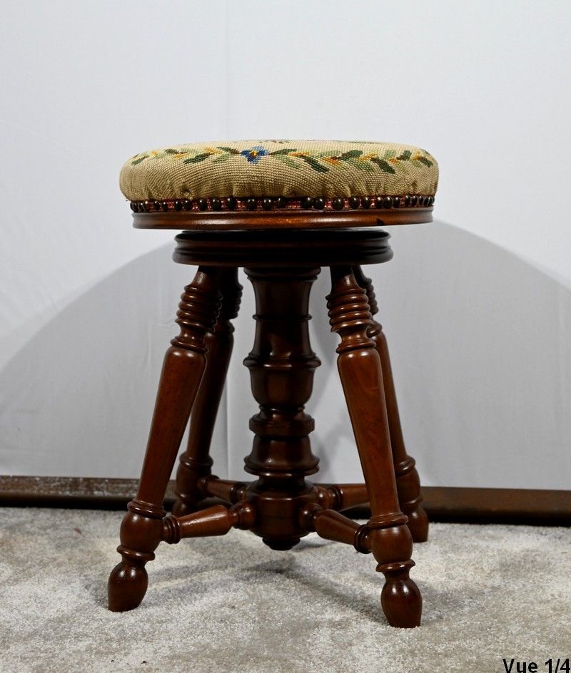 Ancien tabouret de piano réglable en noyer avec siège en…