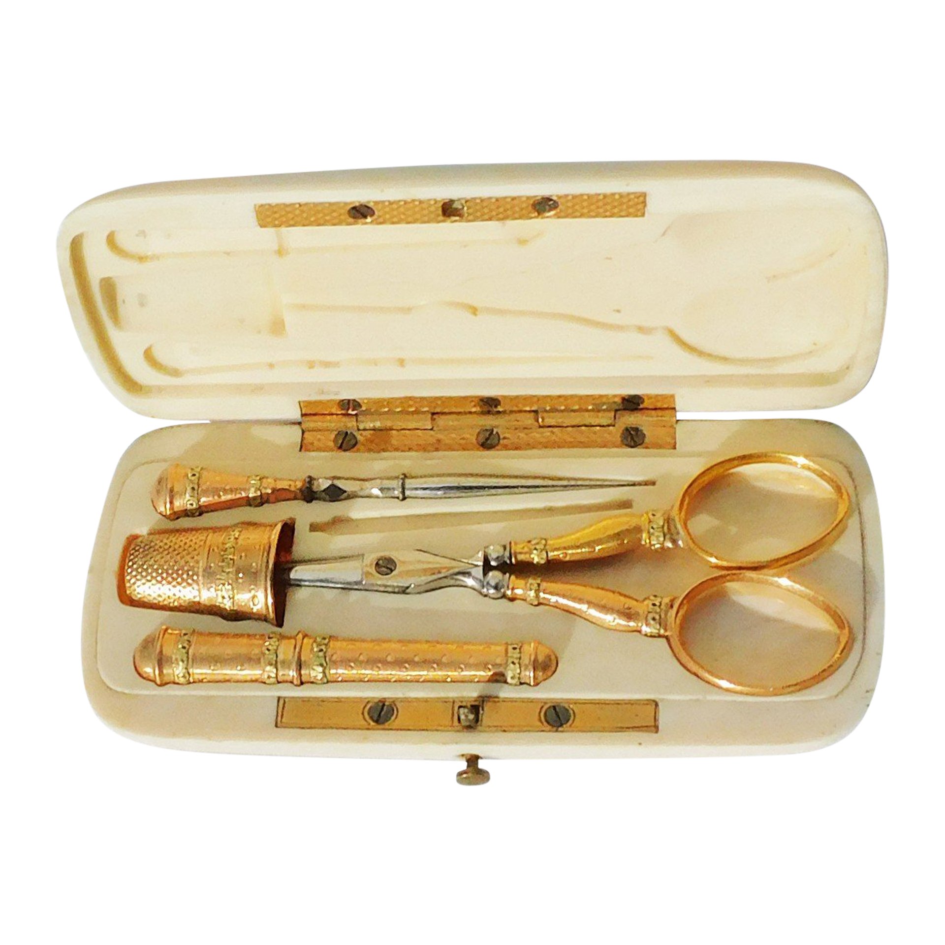 Vintage gold sewing kit with box