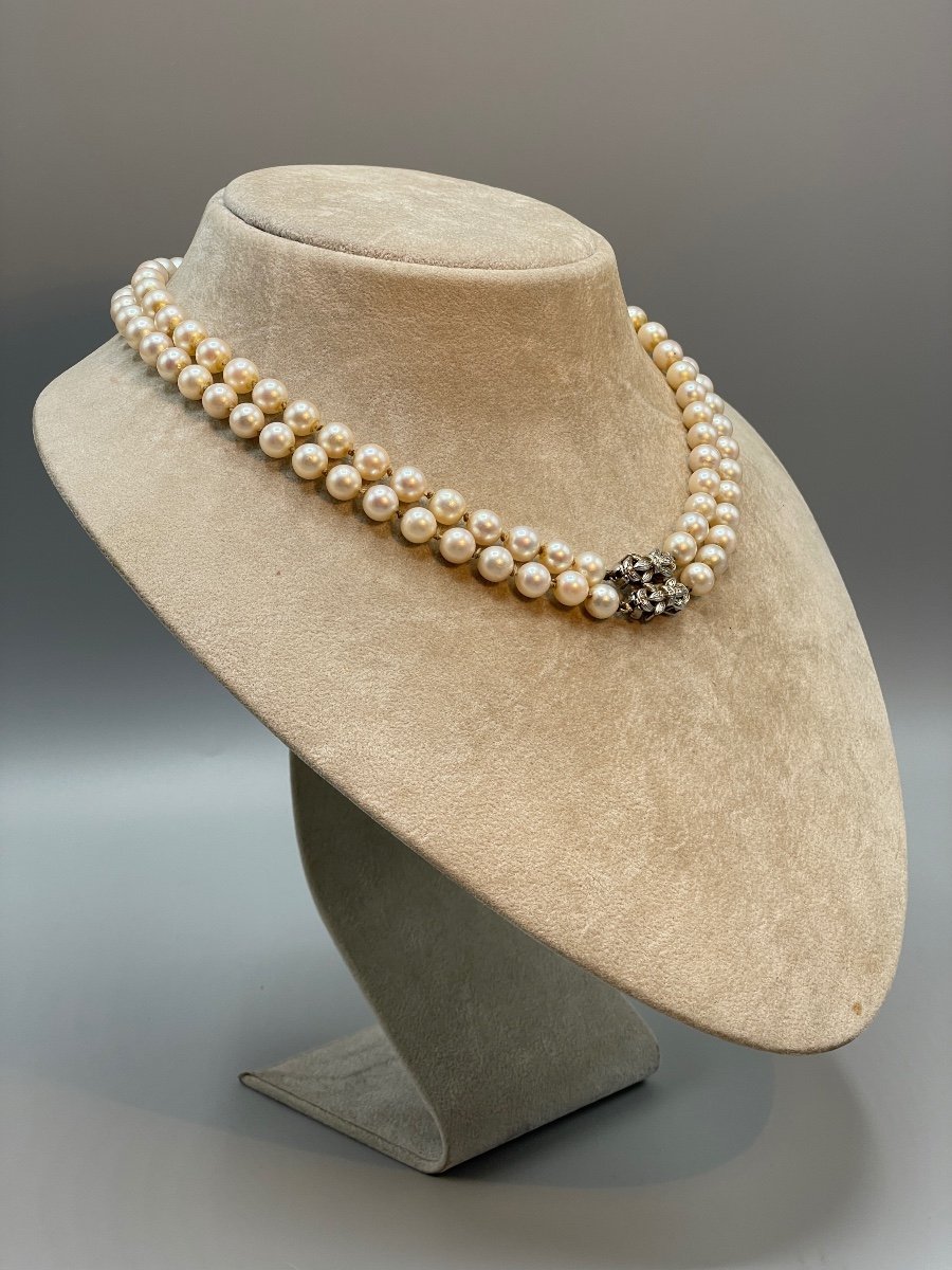 Double strand pearl necklace with diamond clasp top