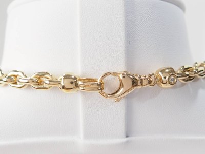 Collier maille forcat limée en chute en or jaune et diamant