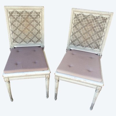 Suite De Six Chaises Louis XVI Cannées En Bois Rechampi.