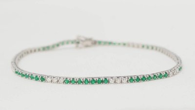 Bracciale fiume in oro bianco, smeraldi e diamanti