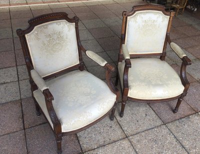Pair of Louis XVI armchairs with flat backs.