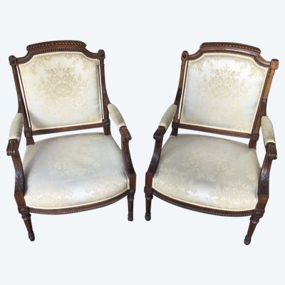Pair of Louis XVI armchairs with flat backs.