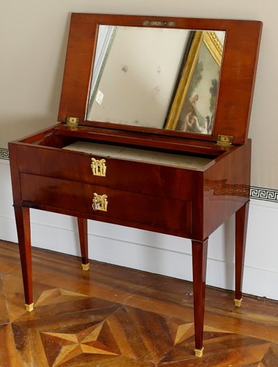 Empire period mahogany dressing table with sliding top