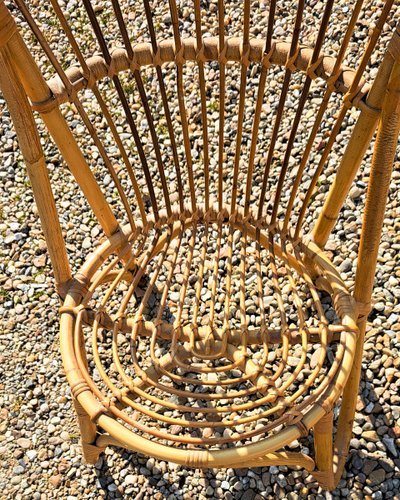 Rattan chair with rounded back from the 60s and 70s