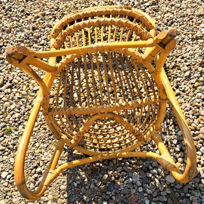Rattan chair with rounded back from the 60s and 70s
