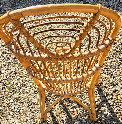Rattan chair with rounded back from the 60s and 70s
