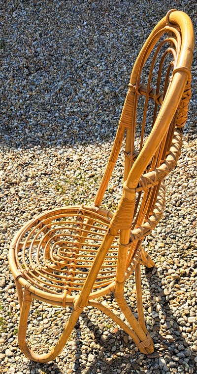 Rattan chair with rounded back from the 60s and 70s