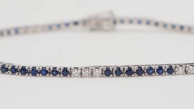 Bracciale fiume in oro bianco, zaffiri e diamanti