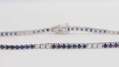 Bracciale fiume in oro bianco, zaffiri e diamanti