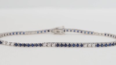 Bracciale fiume in oro bianco, zaffiri e diamanti
