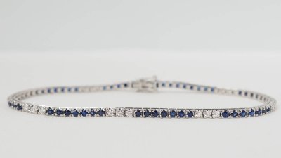 Bracciale fiume in oro bianco, zaffiri e diamanti