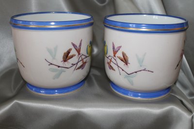 Pair of hand-painted Paris porcelain pot holders from the Louis Philippe period