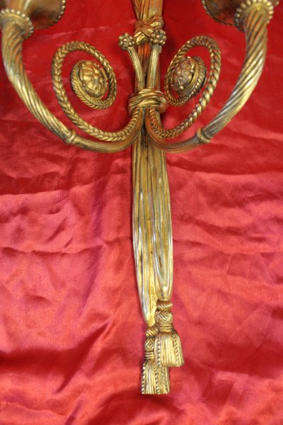 Pair of large bronze sconces with passementerie decoration in the 19th century Louis XVI style h: 60 cm