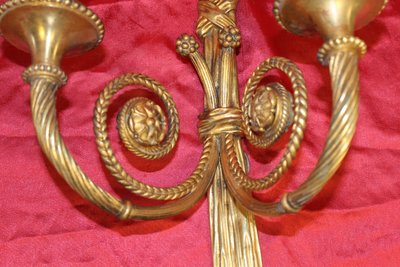 Pair of large bronze sconces with passementerie decoration in the 19th century Louis XVI style h: 60 cm