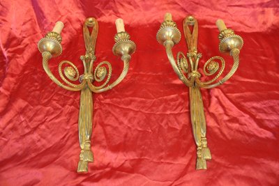 Pair of large bronze sconces with passementerie decoration in the 19th century Louis XVI style h: 60 cm