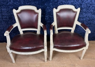 Pair of Louis XVI cabriolet armchairs in lacquered wood and leather circa 1850