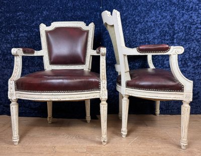 Pair of Louis XVI cabriolet armchairs in lacquered wood and leather circa 1850