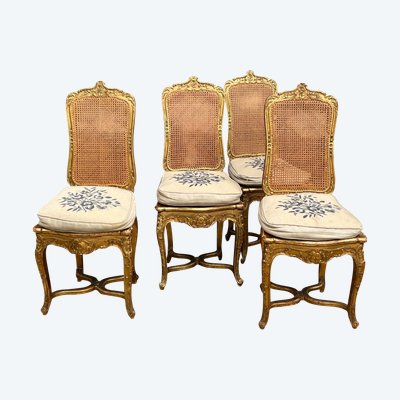 SÉRIE DE 4 CHAISES CANNÉES EN BOIS SCULPTÉ ET DORÉ DE STYLE LOUIS XV ÉPOQUE XIXe