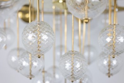 Large gilded brass chandelier with decorative balls. 1970s.LS62621809P