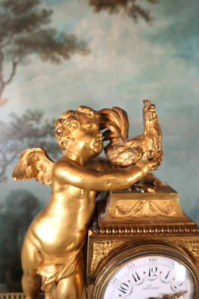 Gilt bronze clock "l'angelot au coq" Louis XVI style, 19th century
