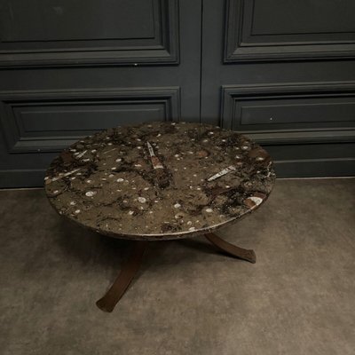 Coffee table with fossilized stone top and Brutalist legs 1970