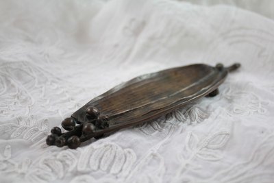 Patinated bronze 'Lily of the valley leaf' pocket tidy circa 1900
