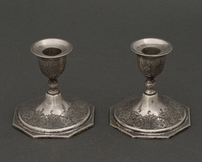 Pair of 19th century Persian silver candlesticks, engraved with bird design, hallmarked 84