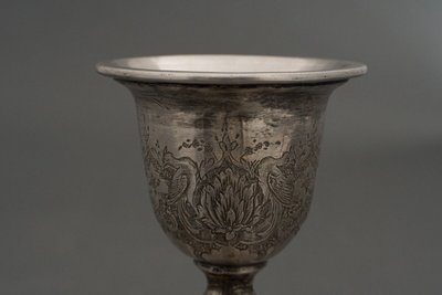 Pair of 19th century Persian silver candlesticks, engraved with bird design, hallmarked 84
