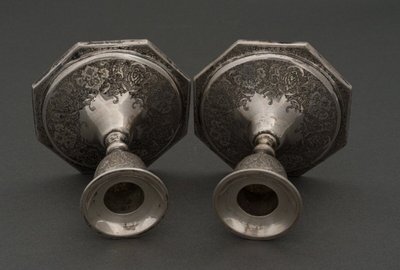 Pair of 19th century Persian silver candlesticks, engraved with bird design, hallmarked 84