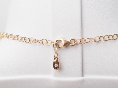 Collier boules rigide et trèfles en or rose et diamants