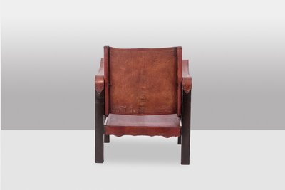 Poltrona “Safari” in legno e pelle cognac. Anni '60/'70. Codice articolo: LS6311309M