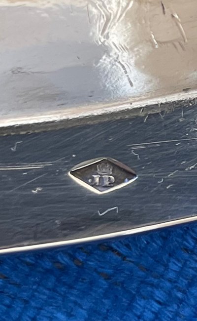 Semi-hollow solid silver dish.