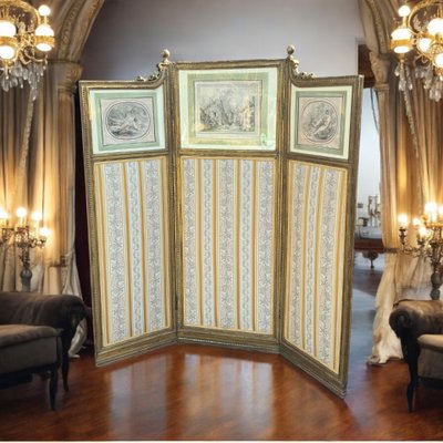 ANTIQUE SCREEN WITH 3 LEAVES IN CARVED AND GILDED WOOD WITH 19TH CENTURY ENGRAVINGS