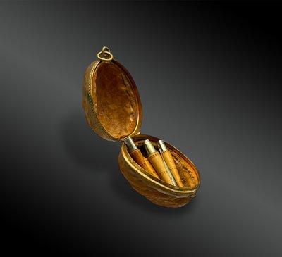 WALNUT SHELL and its 7 miniature NONTRON KNIVES - France - 20th century