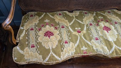 Louis XV period sofa with cane base, Lyonnais work attributed to Pierre Nogaret.