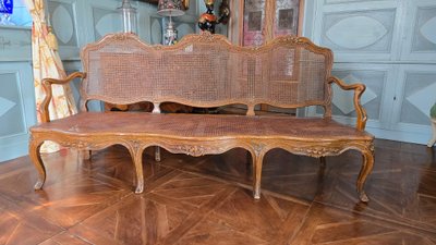Louis XV period sofa with cane base, Lyonnais work attributed to Pierre Nogaret.