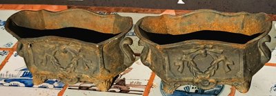 Pair of small cast-iron planters in the Louis XVI style