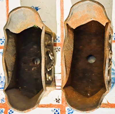Pair of small cast-iron planters in the Louis XVI style
