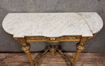 Louis XVI style half-moon console in gilded and carved wood circa 1850