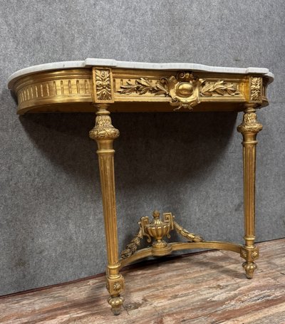 Louis XVI style half-moon console in gilded and carved wood circa 1850