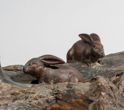 Okimono - Sculpture of rabbits walking in a landscape.