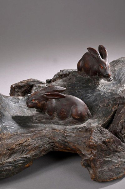 Okimono - Sculpture of rabbits walking in a landscape.