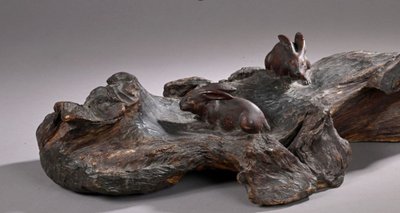 Okimono - Sculpture of rabbits walking in a landscape.