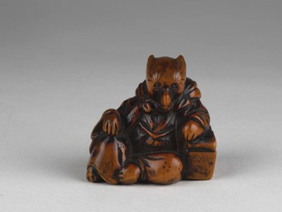 Netsuke - Model representing a fox disguised as a priest. Edo Japan